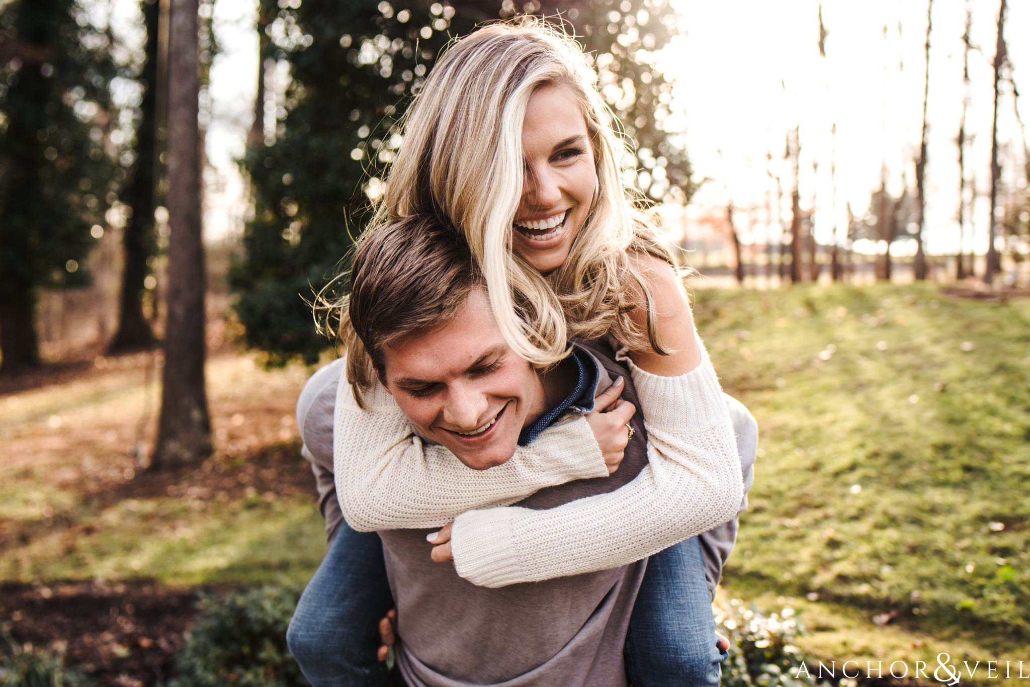 Piggy back Rides during their Dale Earnhardt Inc Engagement Session Mooresville