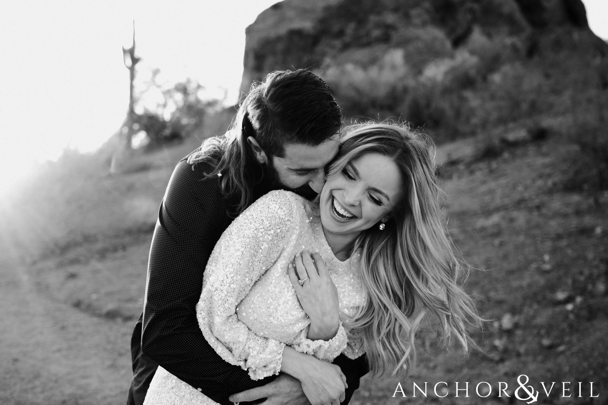 holding tight during their spring training Arizona Papago park engagement session