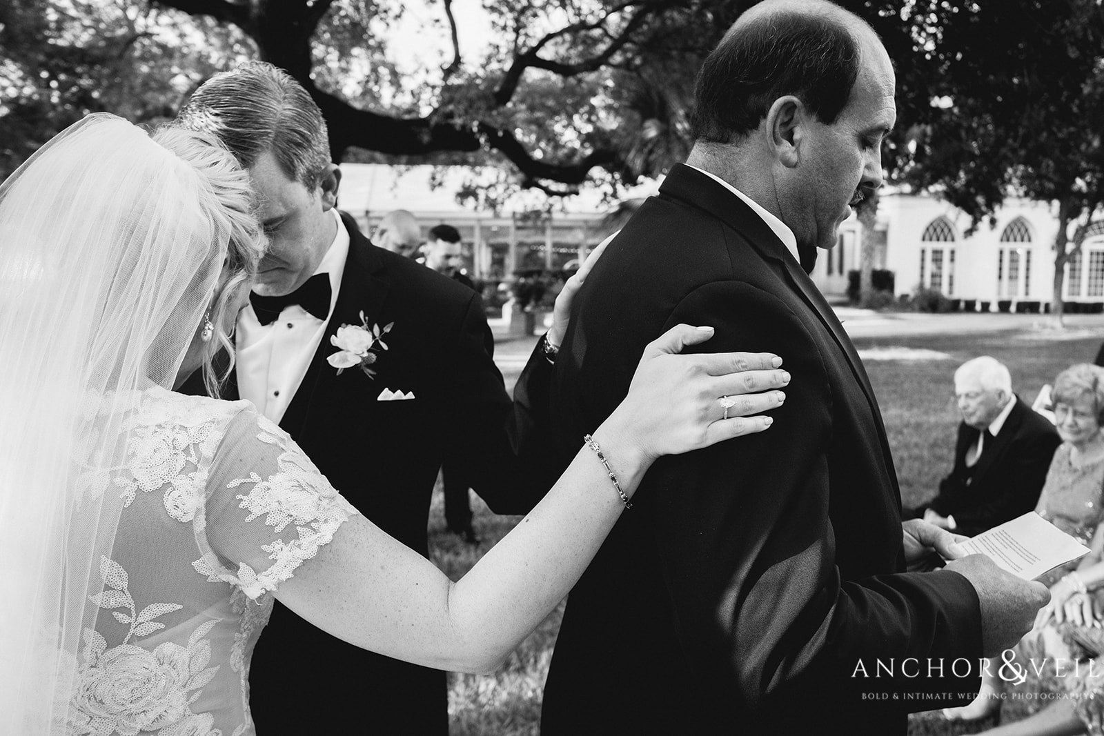 The bridge and groom's hands on the father at the Lowndes Grove Plantation Wedding
