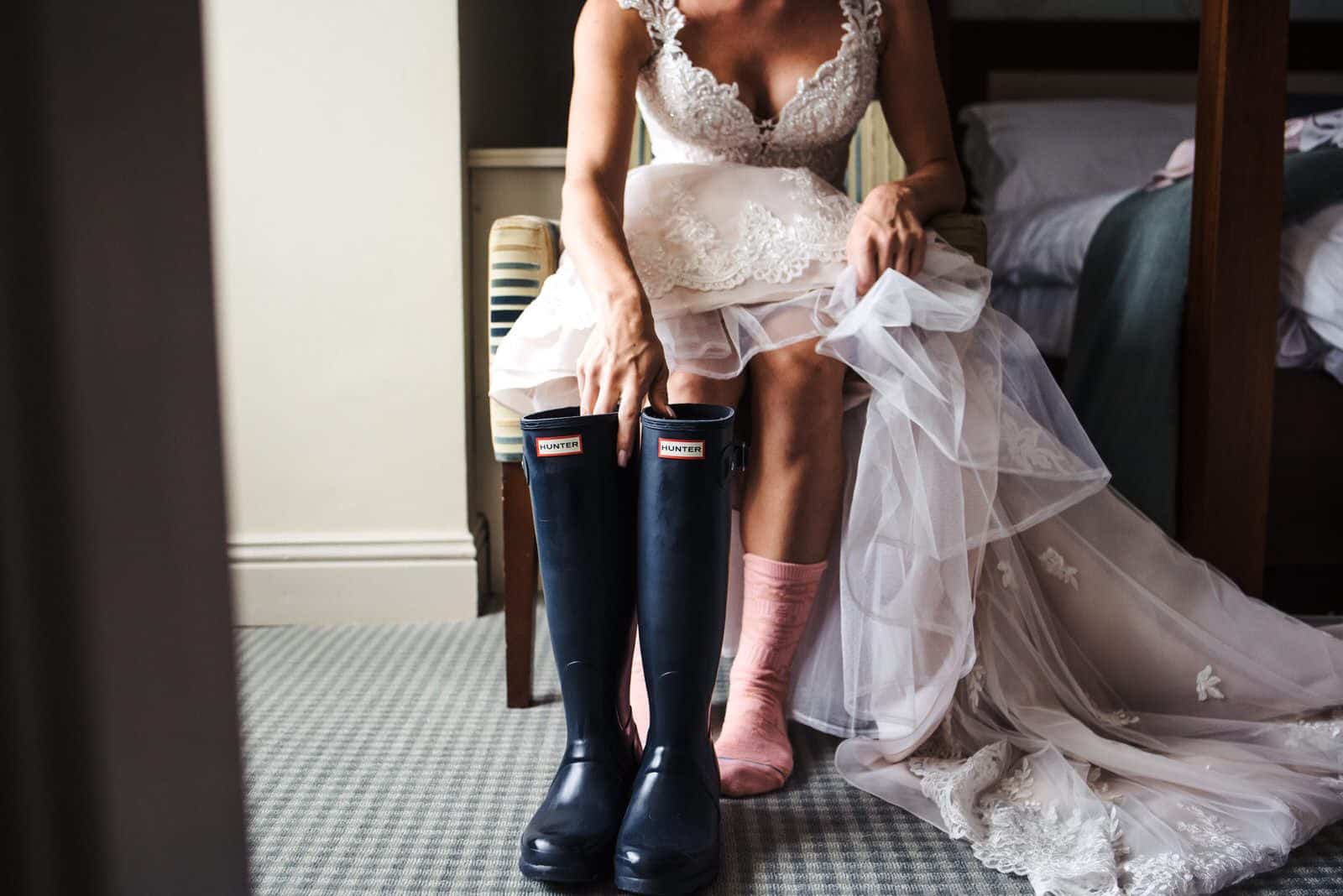 The bride putting on her boots.