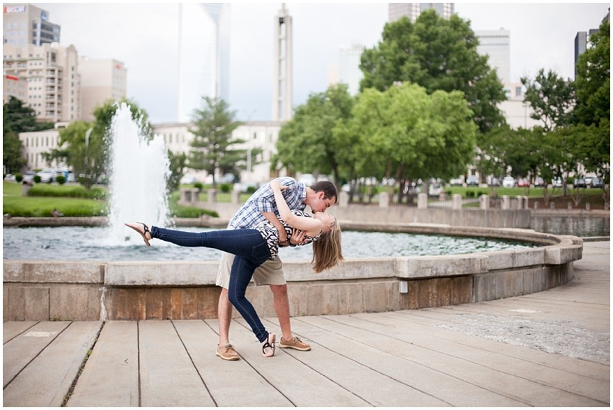Uptown Charlotte Marshall park Engagement kissing fountain background