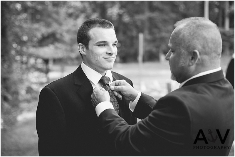 Dad fixing his son's tie before the wedding ceremony in Summerfield amphitheatre in North Carolina