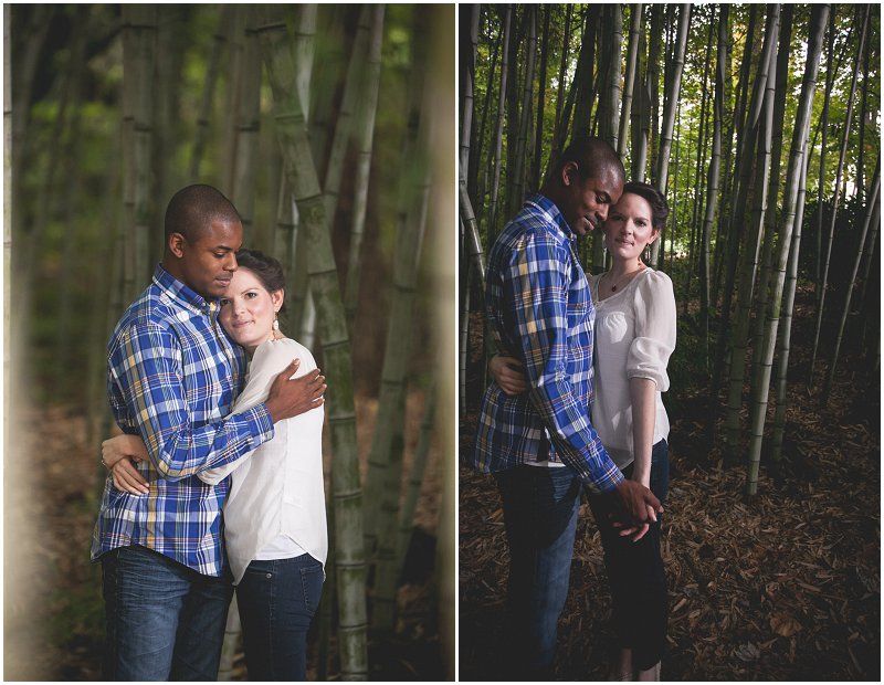 Kissing and embracing in the bamboo frest at the duke gardens during the engagement session