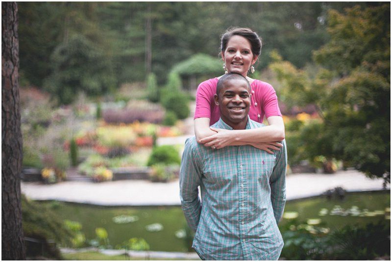 A tight hug overlooking the garden at the Duke Gardens engagement session