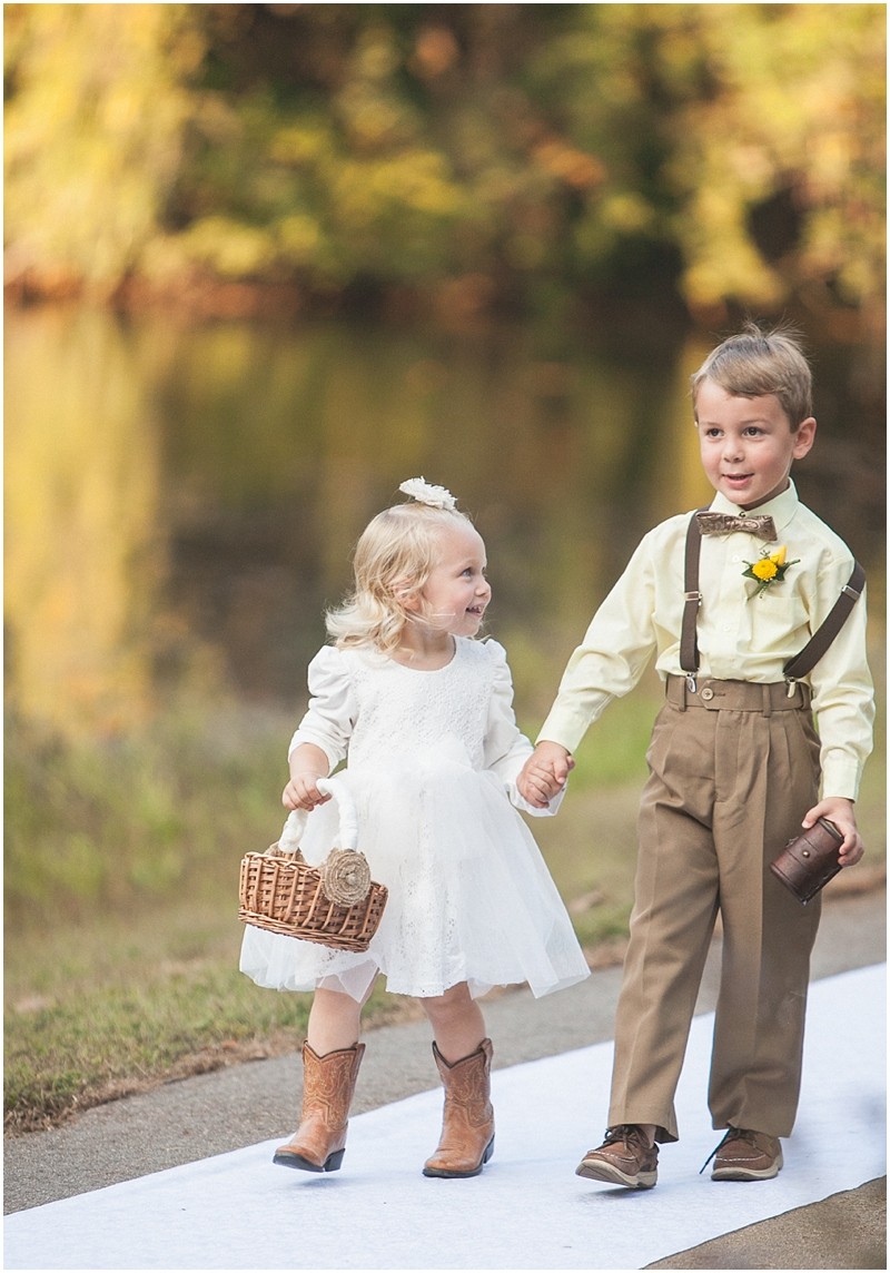The flower girl and ring bearer at the country chic DIY wedding in Tanglewood park Shelter 3 in Winston Salem Clemmons North Carolina