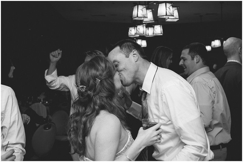 Kissing on the reception dance floor at the Waterfront wedding at the chetola resort and spa in Blowing rock North Carolina