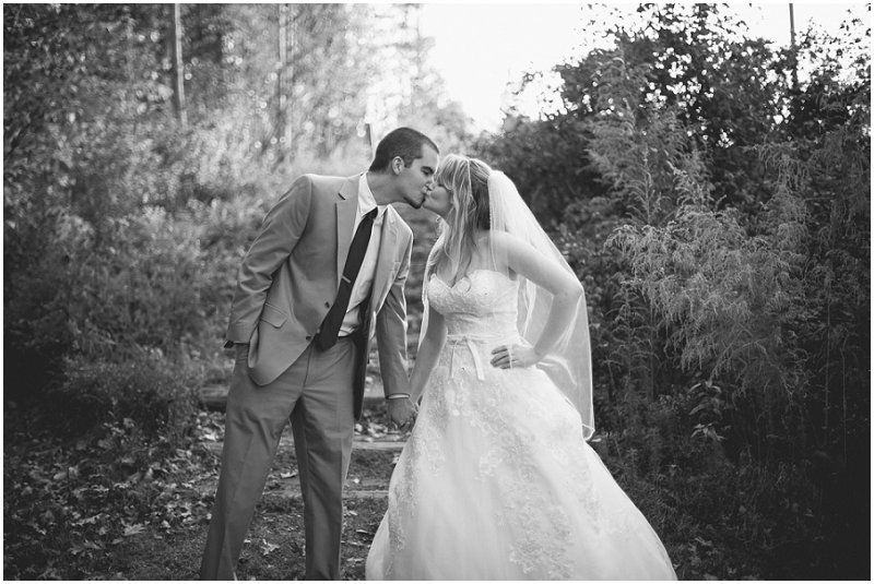 holding hands and kissing during the Day After wedding session in Charlotte north carolina wedding photographers