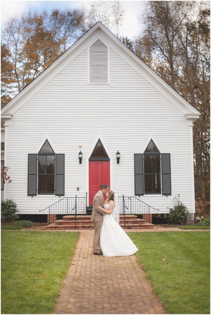 kissing in front of the red church door during the Day After wedding session in Charlotte north carolina wedding photographers