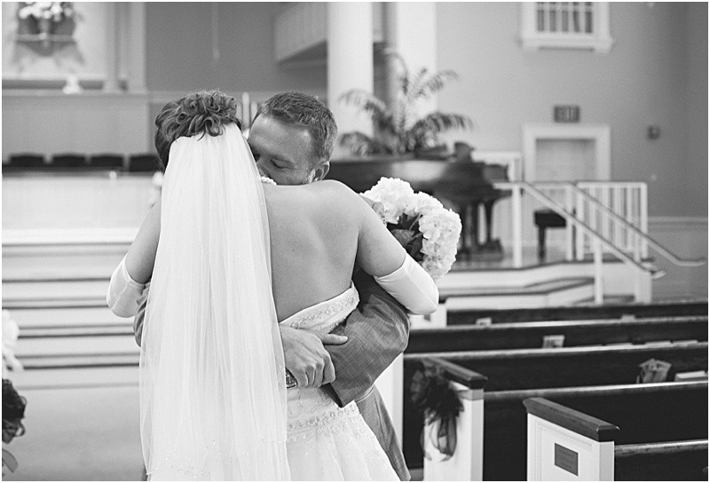 Groom hugging the bride after the first look during the High Point North Carolina Wedding at First Baptist Church High Point and high point country club at Emerywood