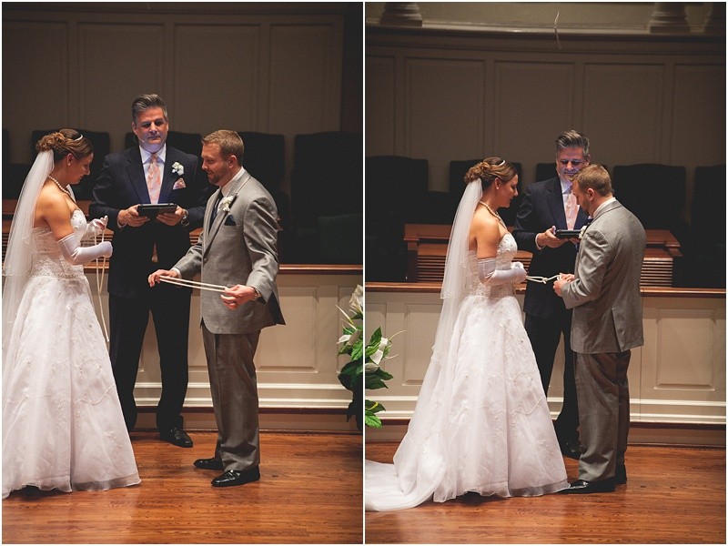 Bride and groom literally tying a knot in rope during the ceremony during the sparkler exit with a fur wrap during the High Point North Carolina Wedding at First Baptist Church High Point and high point country club at Emerywood
