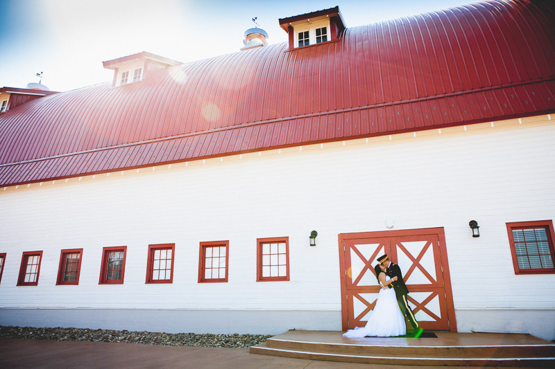 Wedding outside with the sun shining over the barn at the winmock at kinderton in winston salem north carolina
