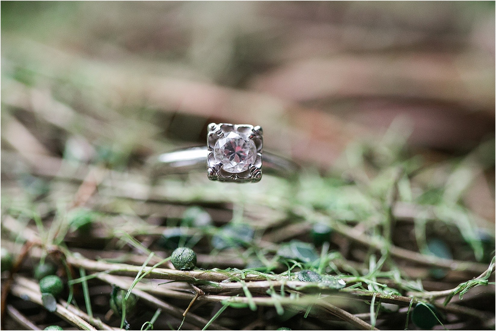 her vintage ring during Andria & Matts Mount Pleasant engagement session in downtown mount pleasant nc