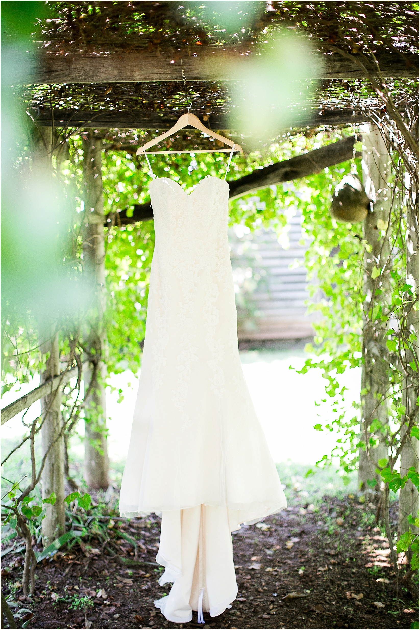 Dress hanging up during their wedding at the Historic Rural Hill wedding ceremony and reception in Huntersville nc