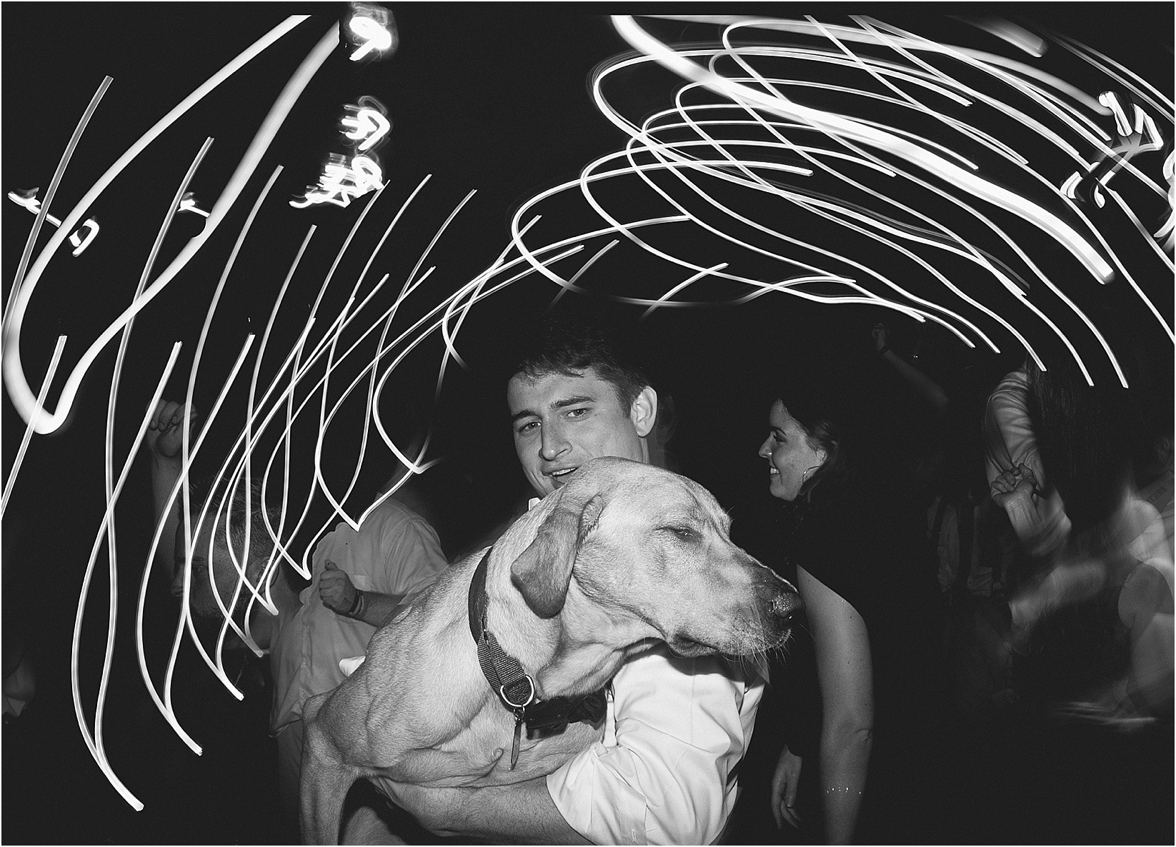 shutter drag with dog during their wedding at the Historic Rural Hill wedding ceremony and reception in Huntersville nc