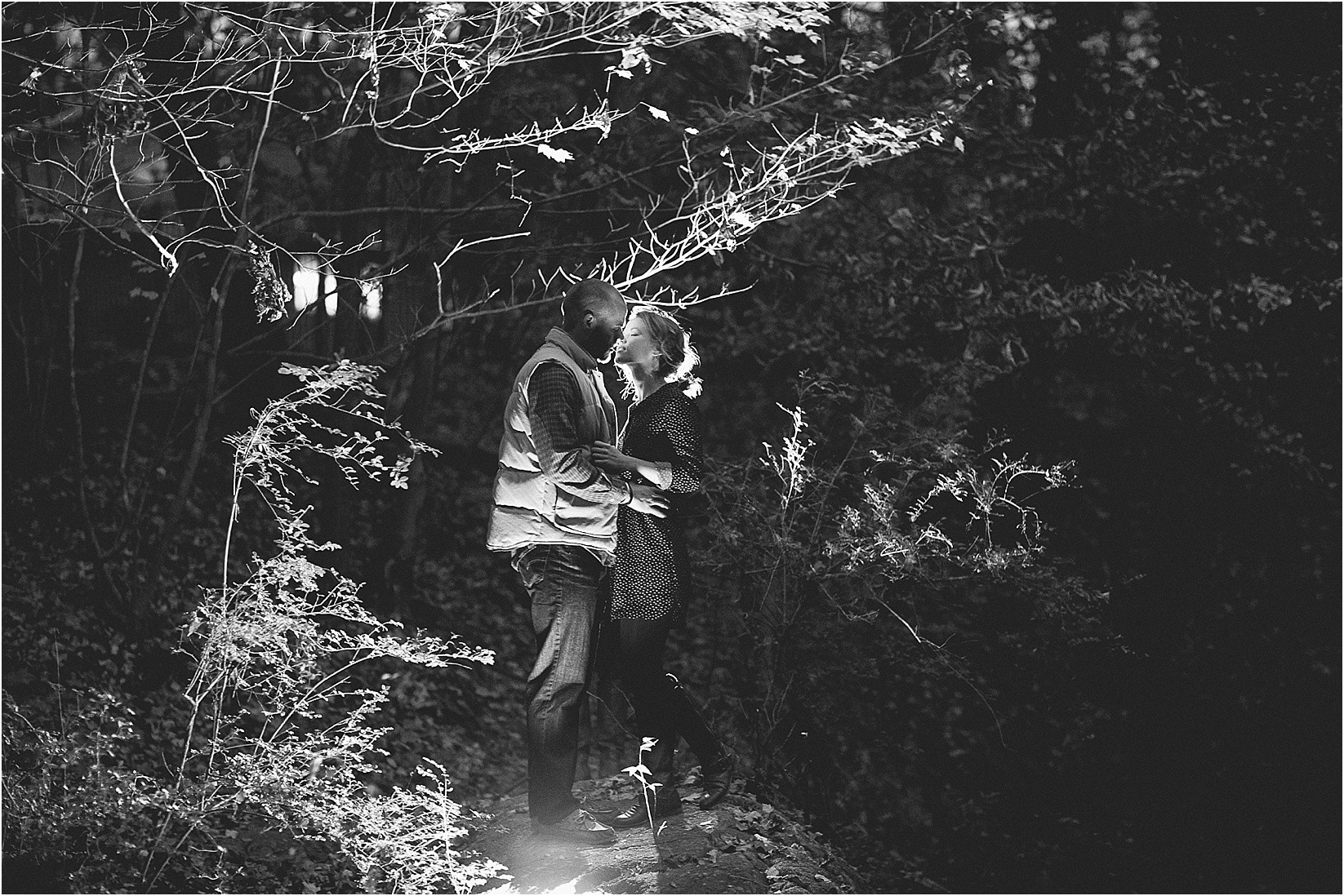Lighting up the woods in an intimate back light with ice light in the woods during their matthews north Carolina engagement session