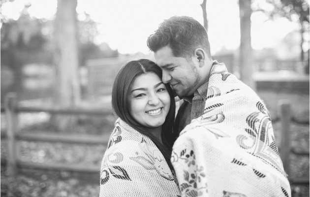 Cuddled and wrapped up in a blanket during the Mcdowell Nature Preserve Engagement Session near lake Wylie north carolina