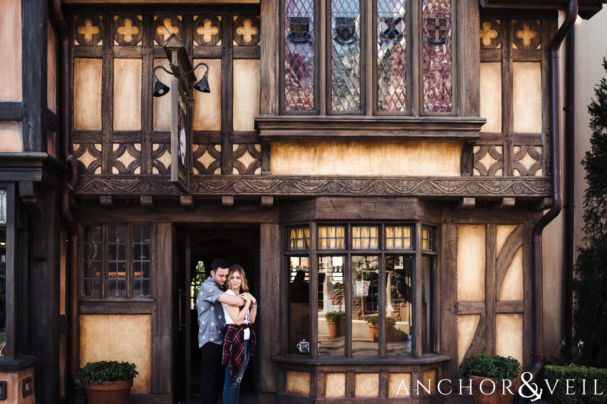 next to the english market during their Disney world engagement session at Disney's Epcot