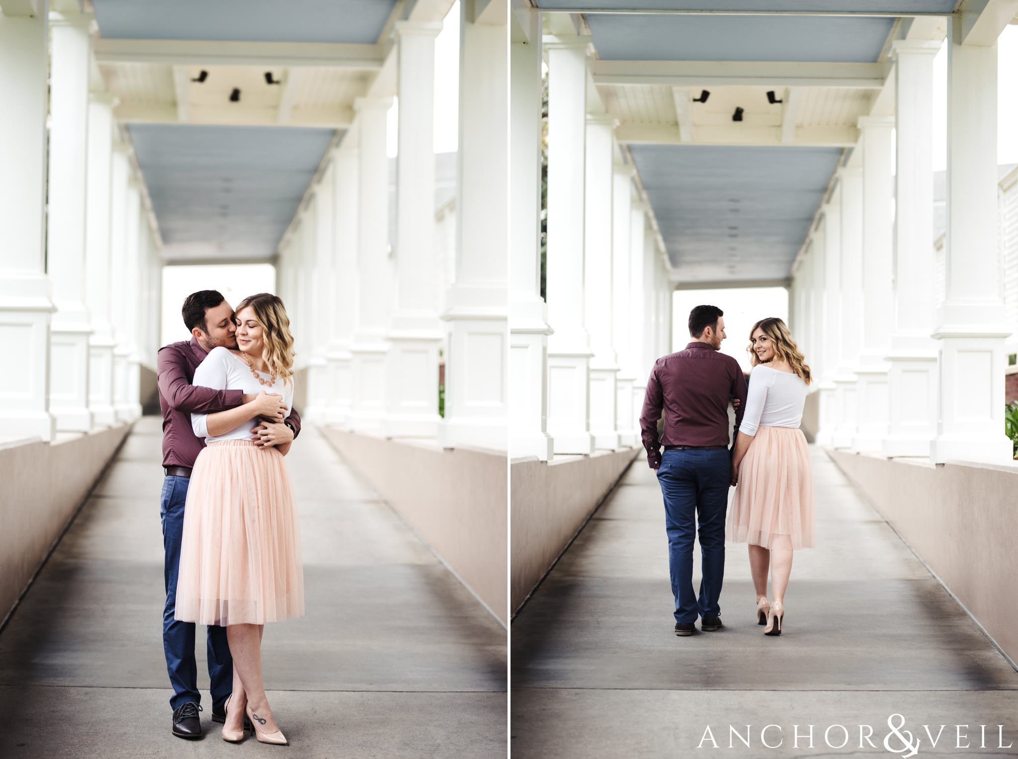 walking down the halls during their Disney world engagement session at the Boardwalk Hotel Inn