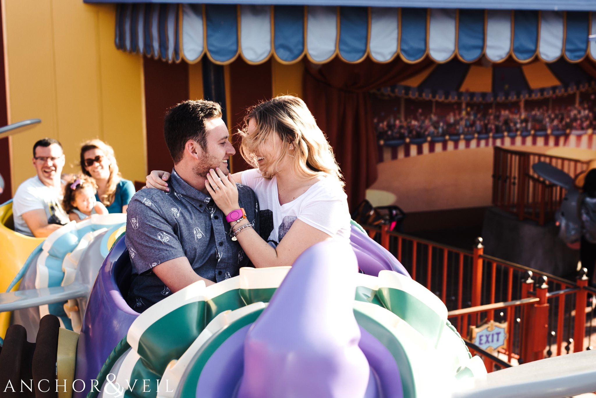 Riding the Dumbo Ride during their Disney world engagement session at Disney's Magic Kingdom