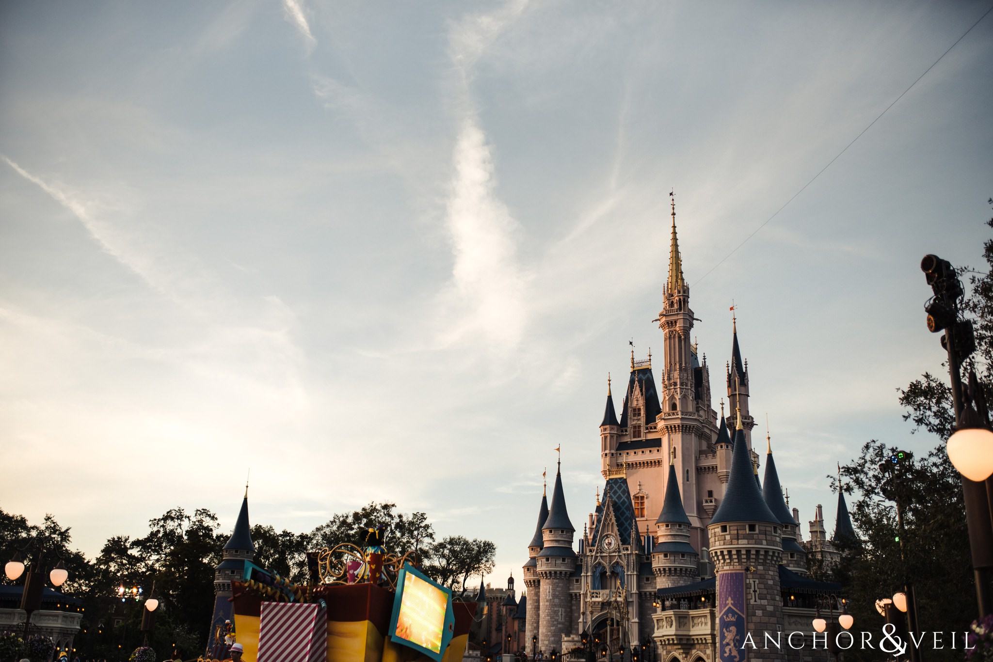Cinderella's Castle during their Disney world engagement session at Disney's Magic Kingdom
