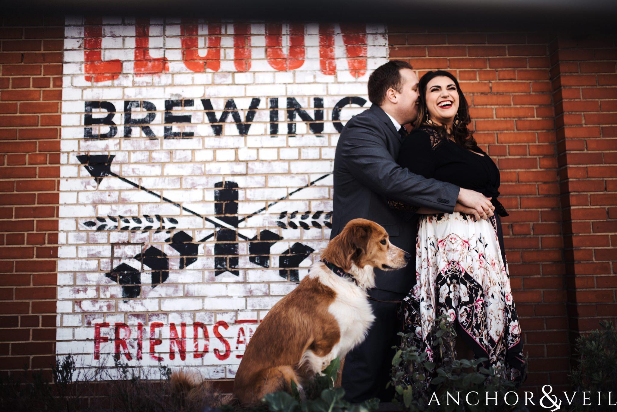in front of Legion brewery during their southend charlotte engagement session