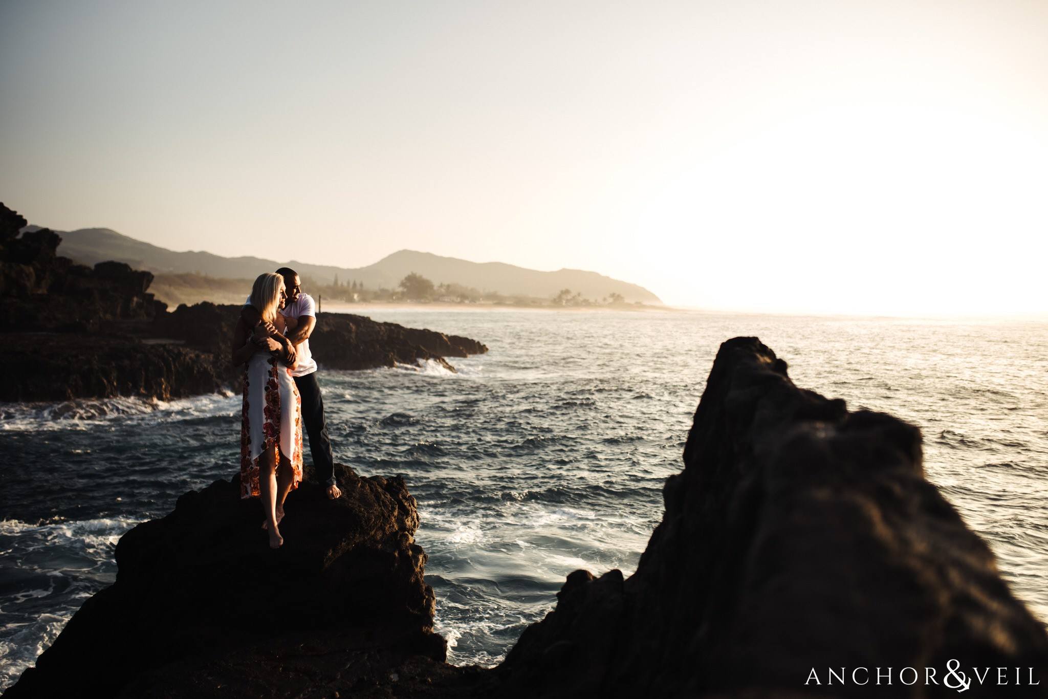 on the rock with good light during their Eternity Beach Session in Honolulu Hawaii Halona Cove