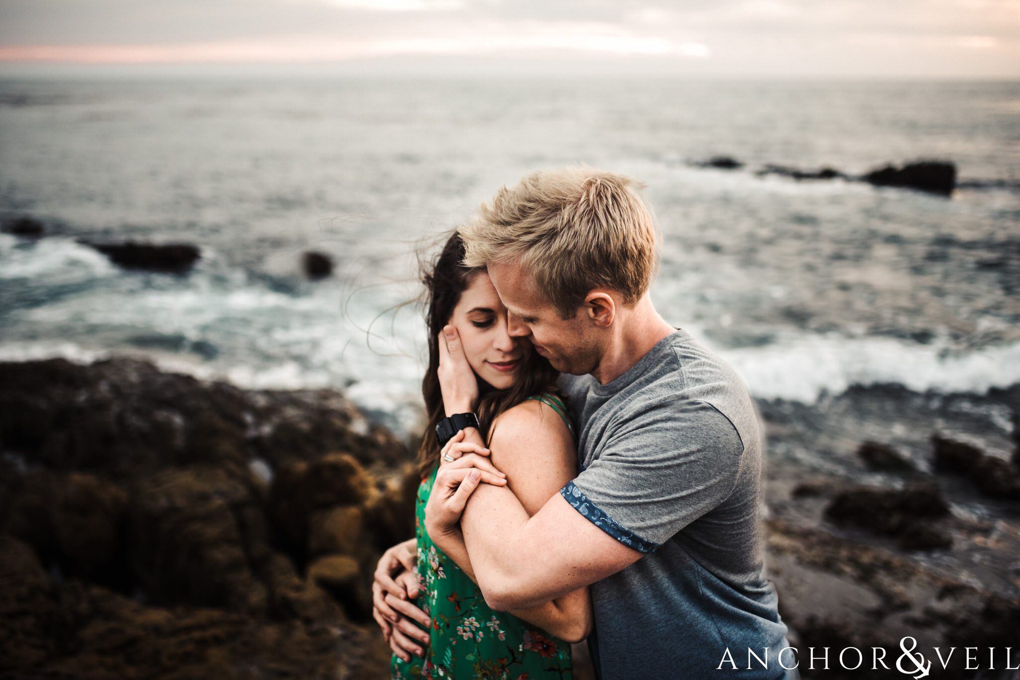 pulling close during their Laguna Beach Engagement Session