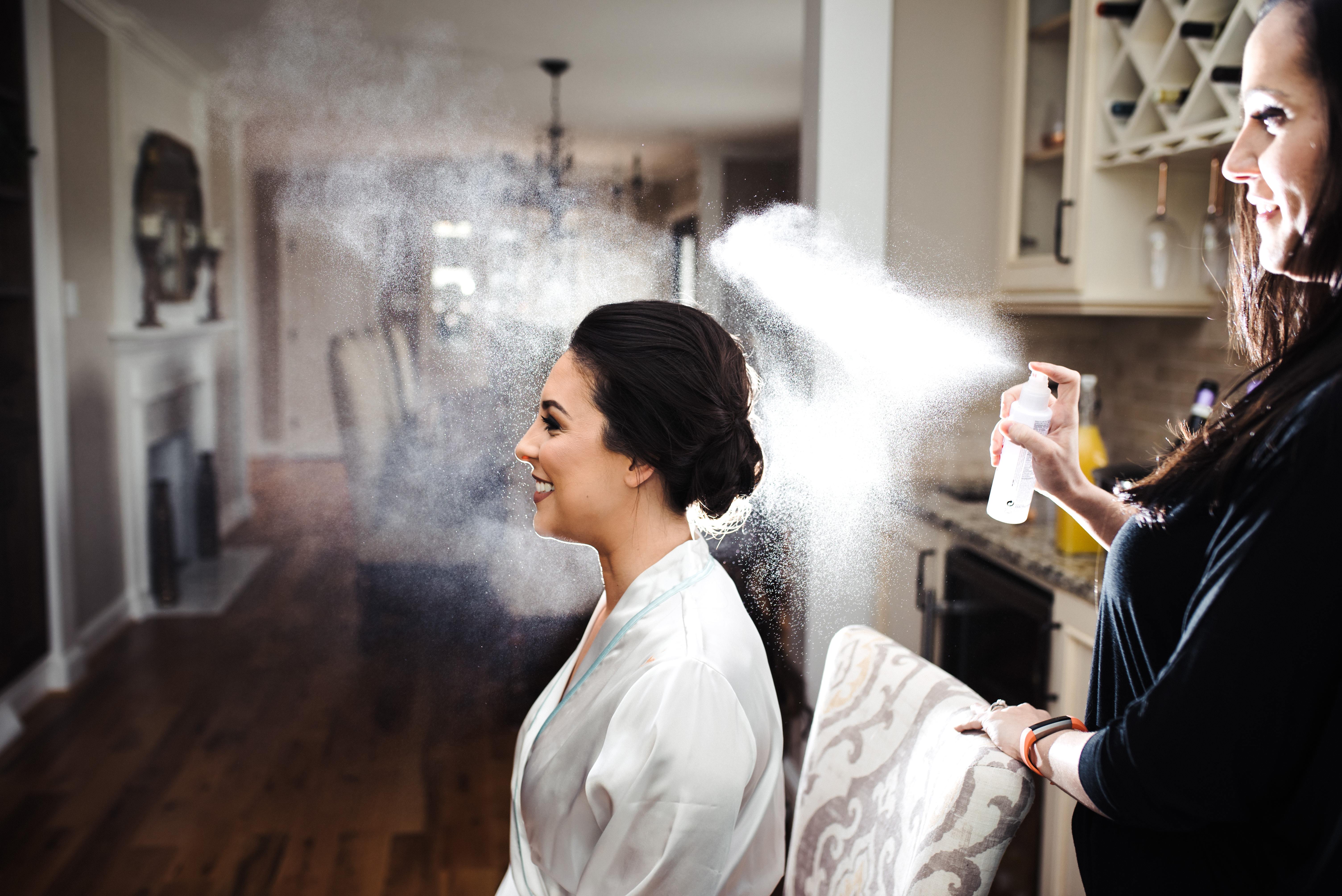 bride getting hairspray