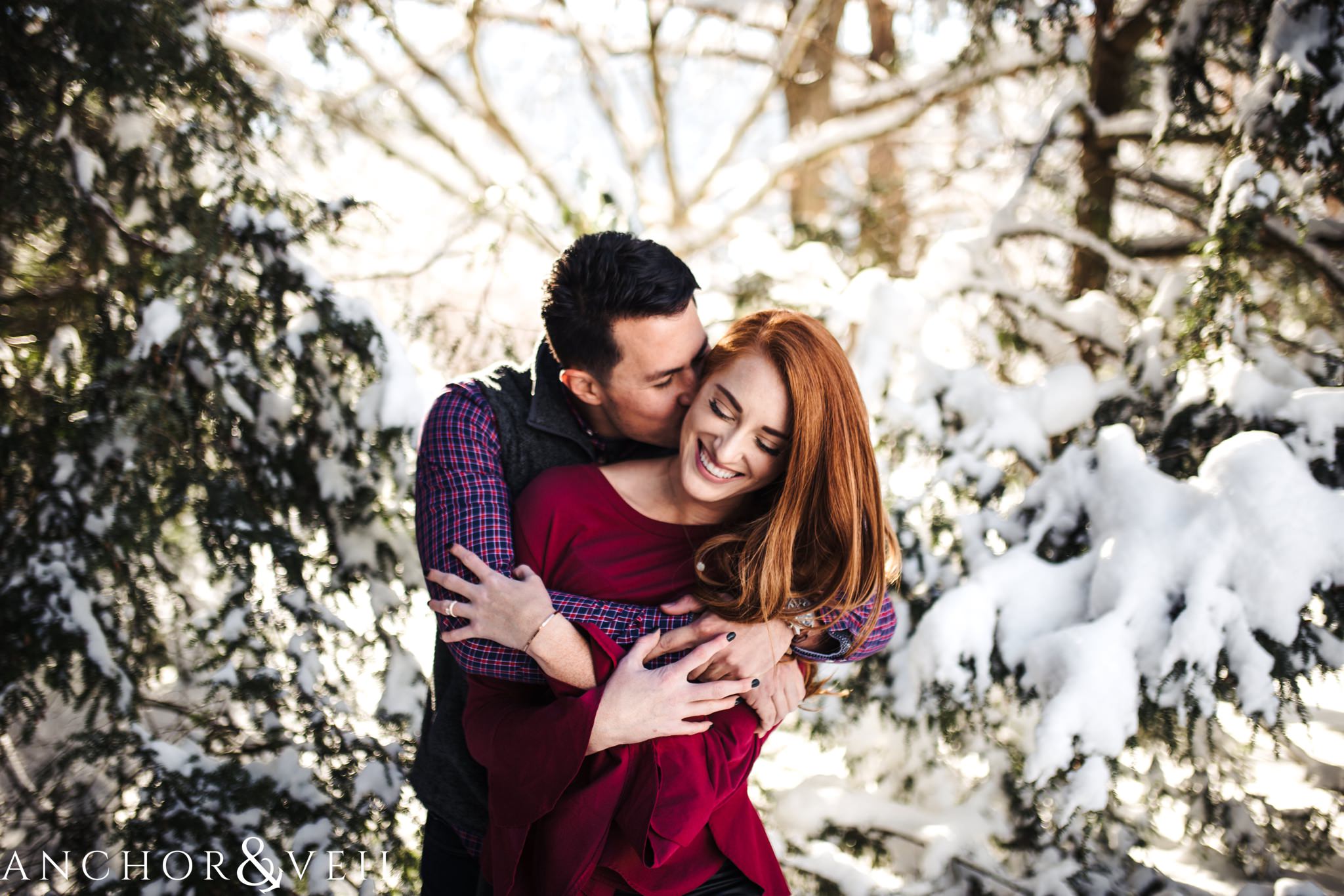  Holding her tight during their Snowy Asheville Engagement Session