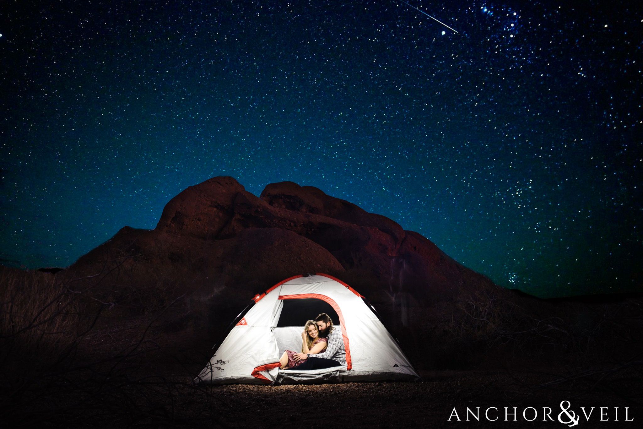 in a tent with stars during their spring training Arizona Papago park engagement session