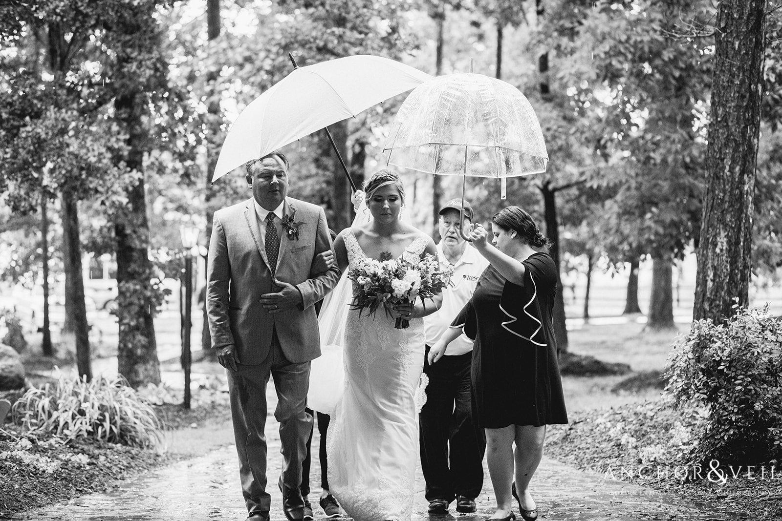 The rain couldn't keep the Bride from walking down the isle at The Farm at Brusharbor Wedding