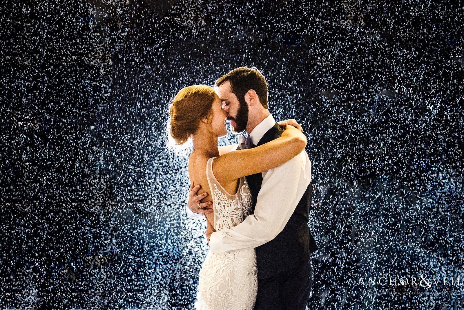 The couple kissing in the rain at the Beech Mountain Ski Resort Wedding
