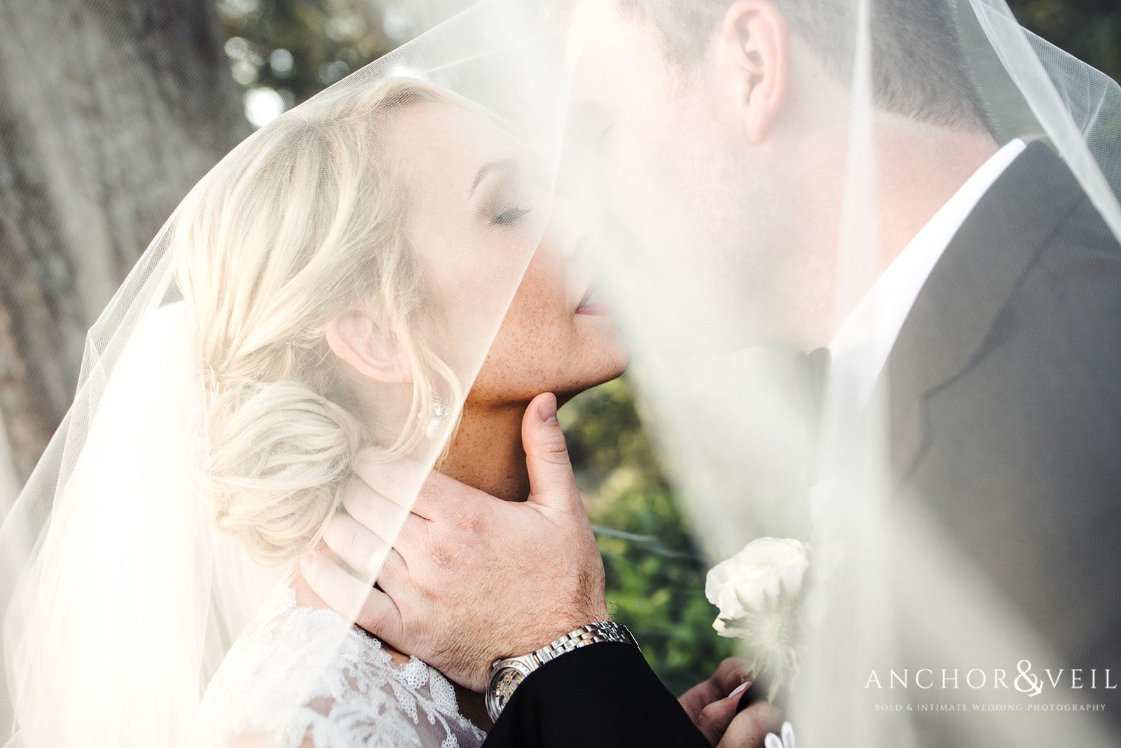 The bridge and groom under the veil at the Lowndes Grove Plantation Wedding