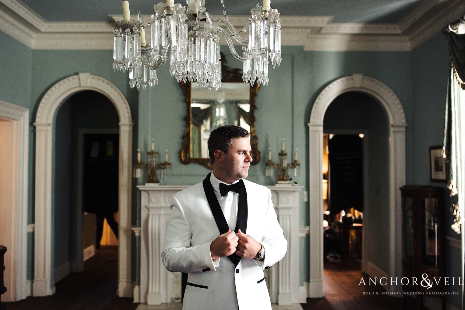The groom in his dinner jacket for the reception at the Lowndes Grove Plantation Wedding