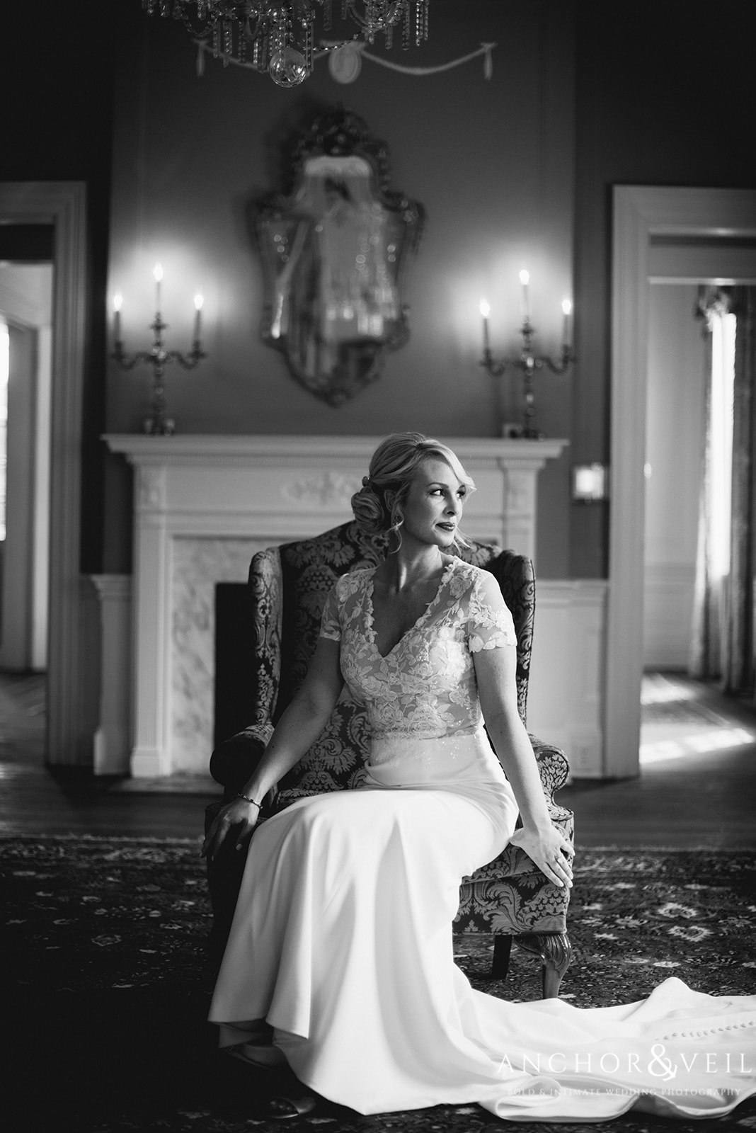 The bride sitting in her dress at the Lowndes Grove Plantation Wedding