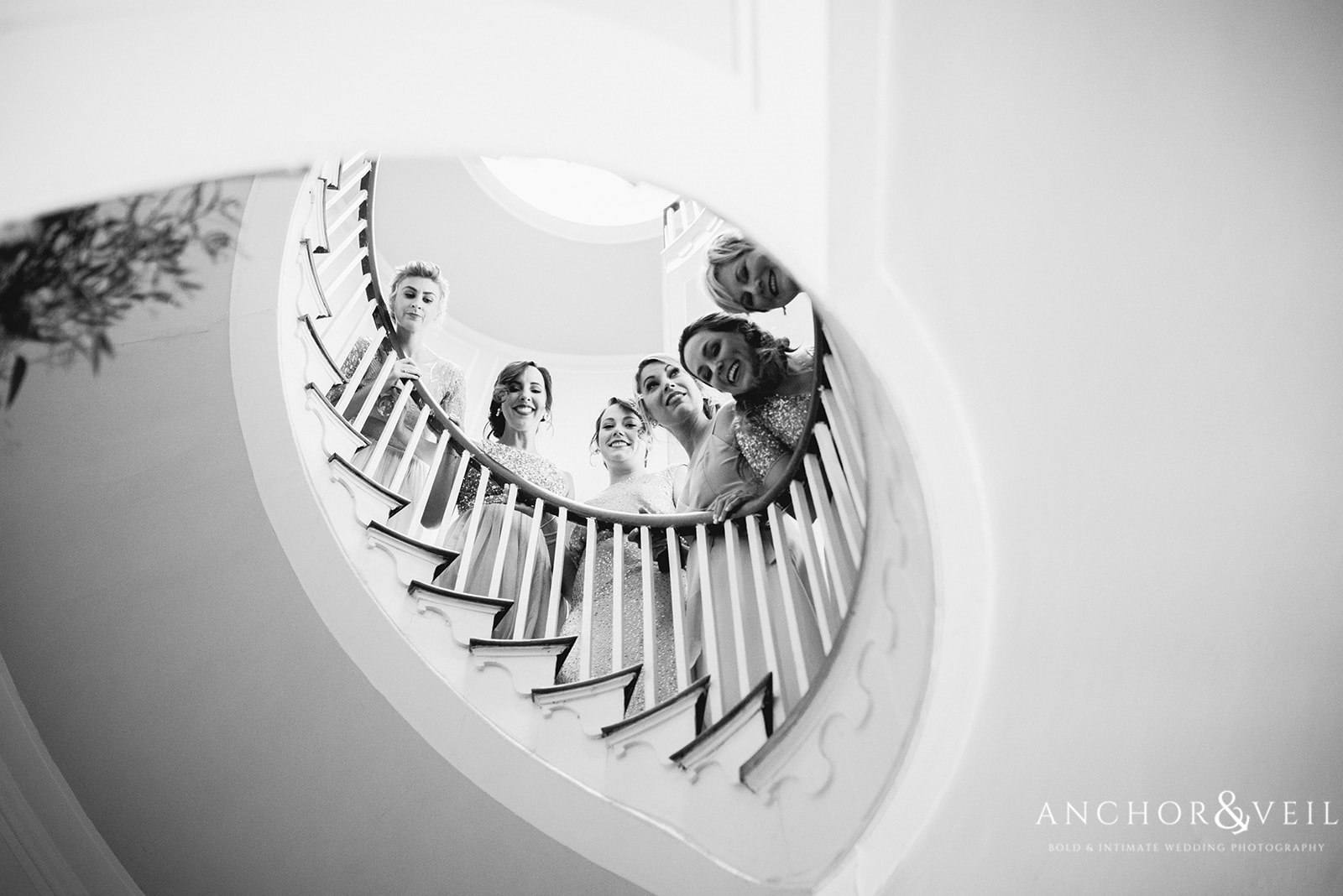 The bridal party sneaking a peak at the First Look at the Lowndes Grove Plantation Wedding