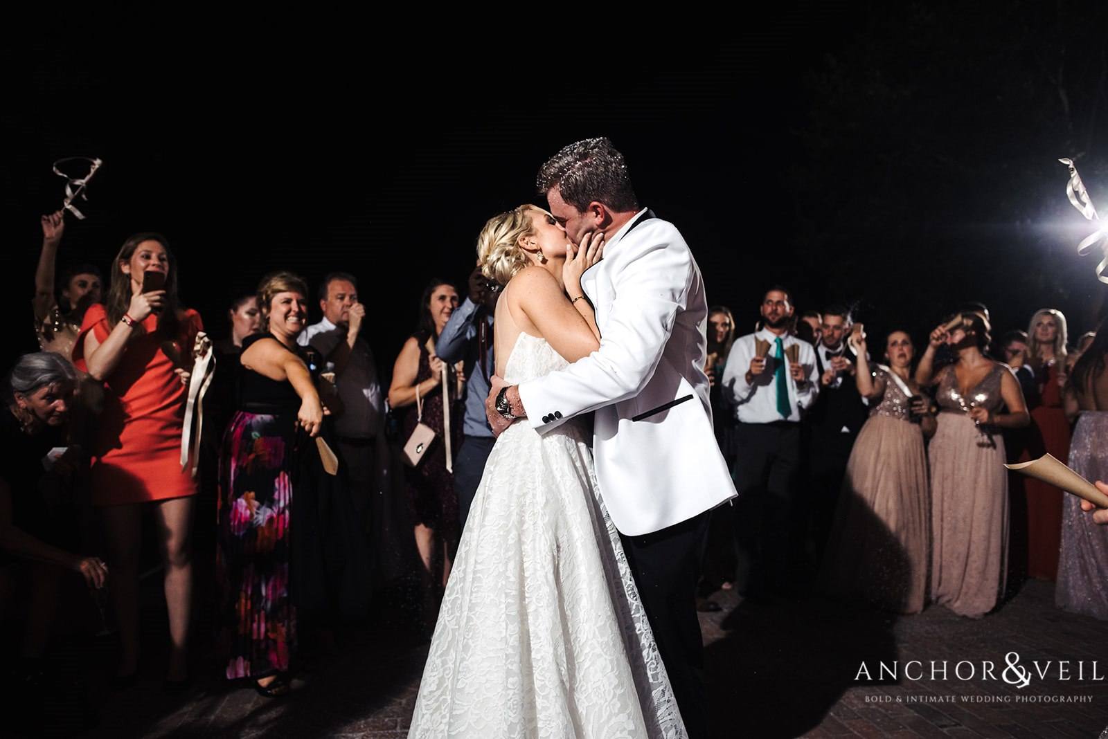The couple's good-bye kiss at the Lowndes Grove Plantation Wedding