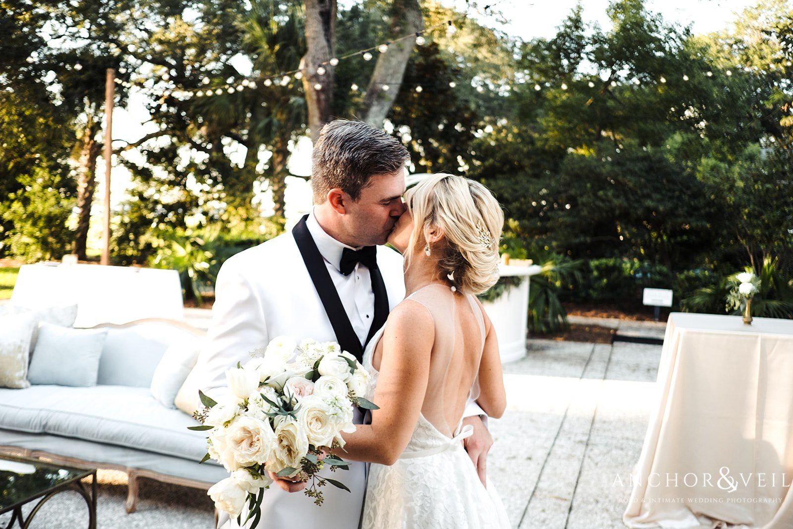 A special kiss before the reception at the Lowndes Grove Plantation Wedding