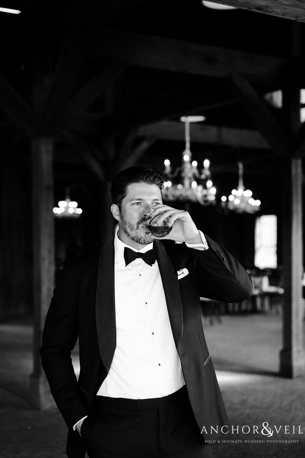 The groom having a drink before the Boone Hall Plantation Wedding 