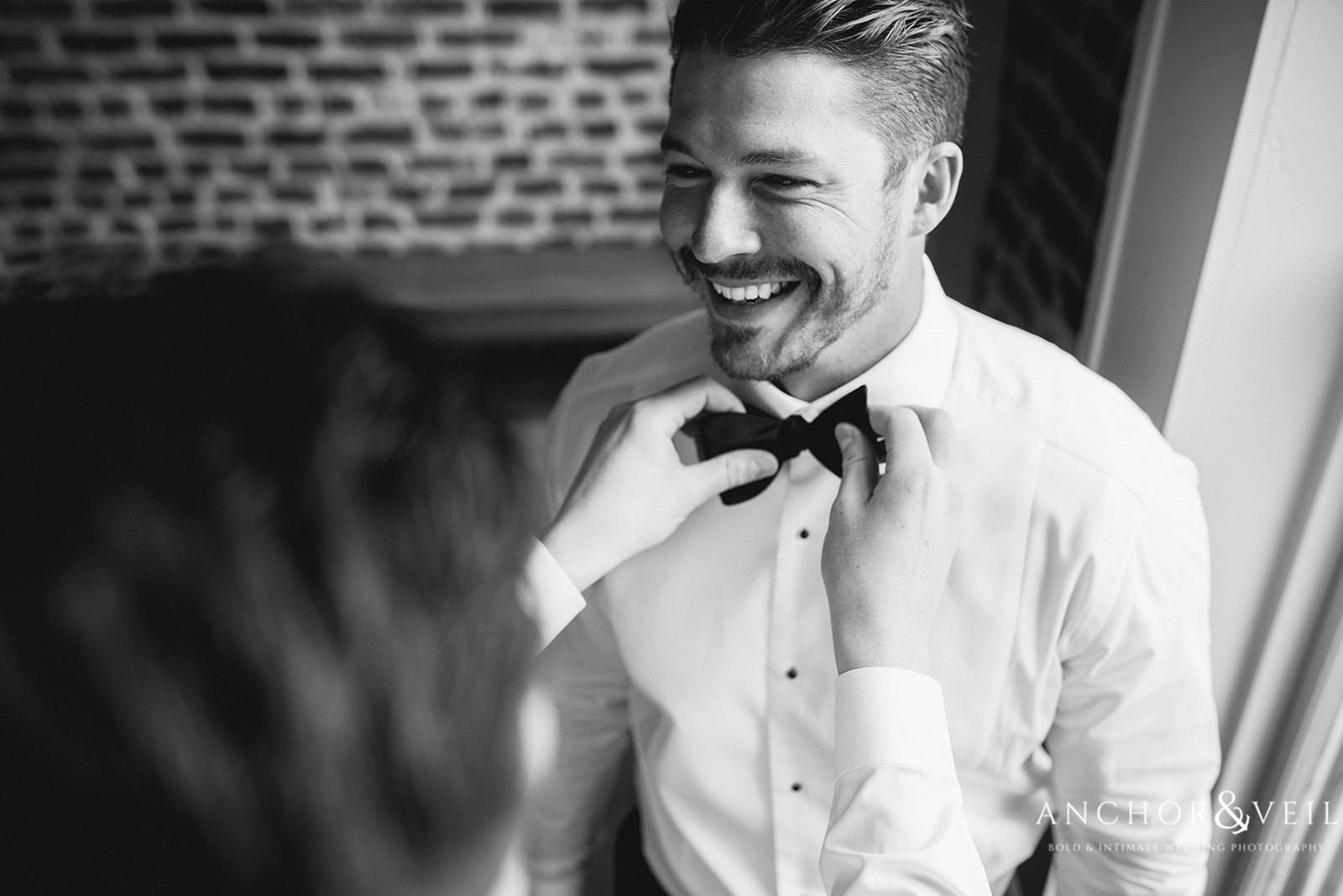 The groom getting his bowtie adjusted at the Boone Hall Plantation Wedding 