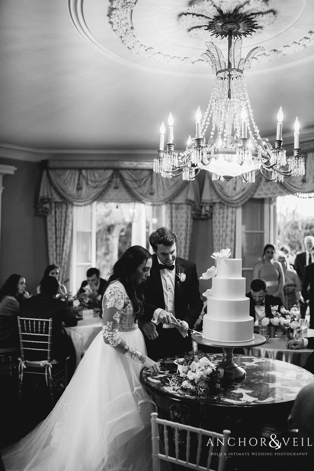 The bride and groom cutting the cake at the William Aiken House Wedding