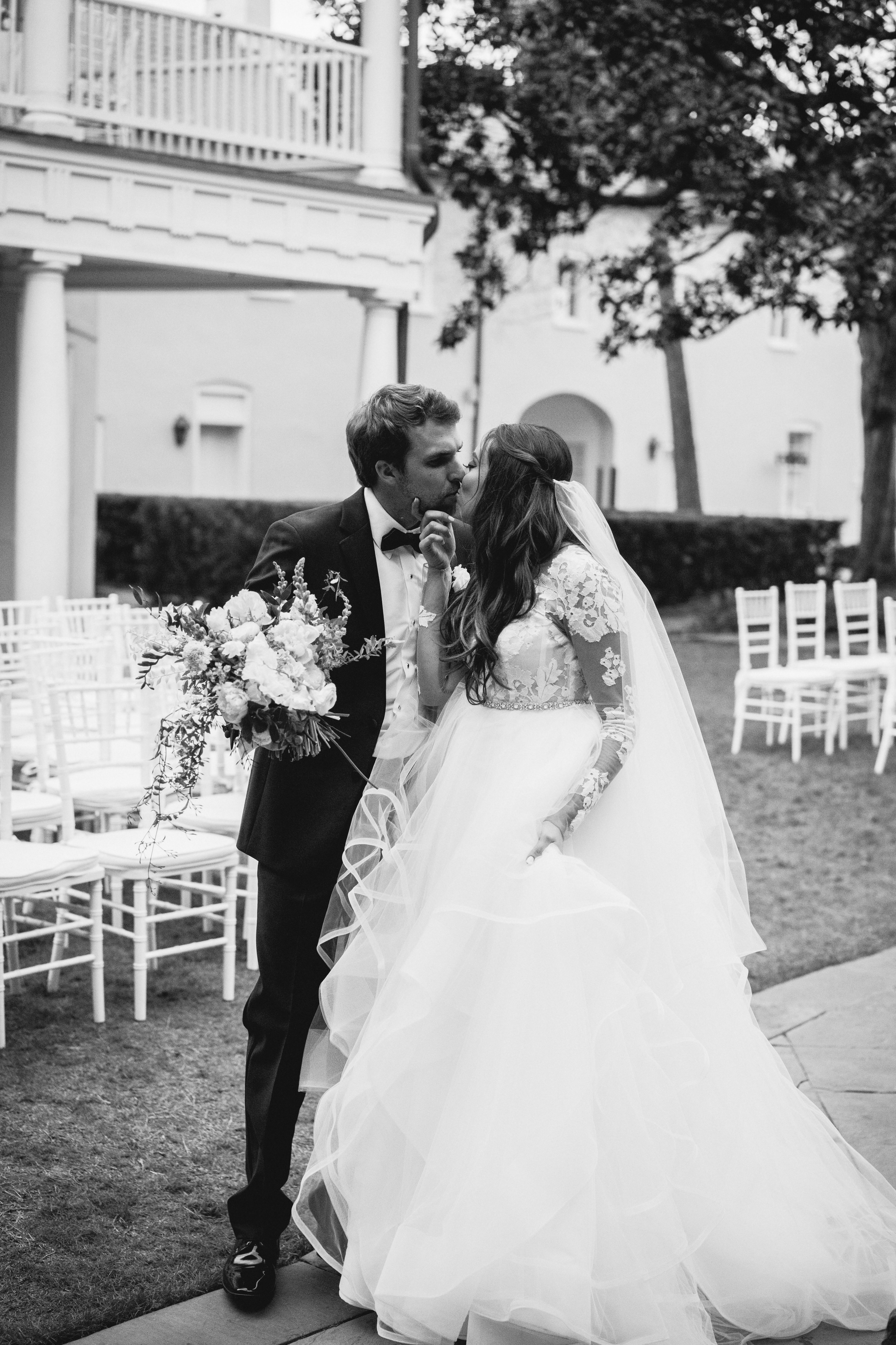 The bride and groom kissing after the ceremony at the William Aiken House Wedding