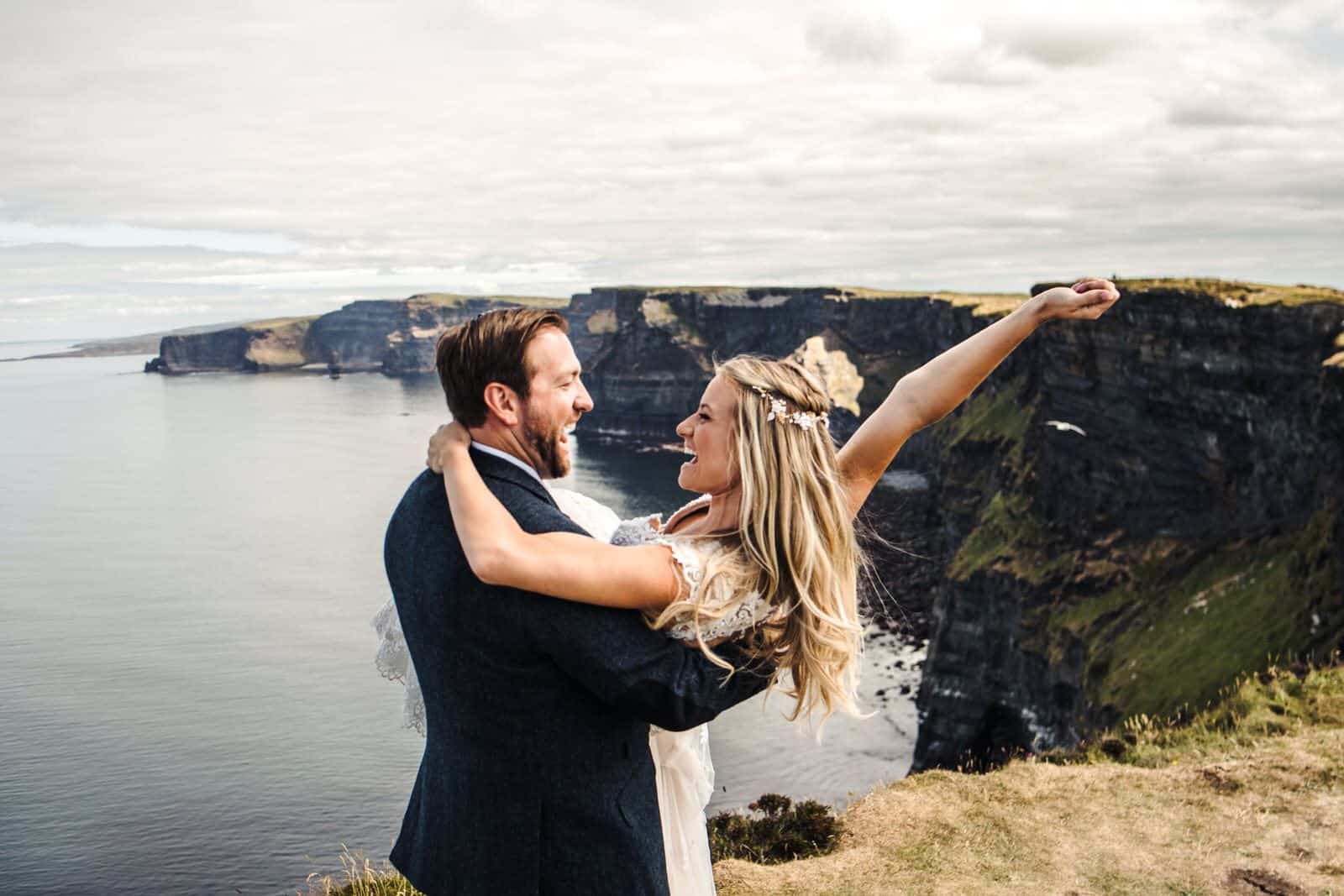 Celebrating at the cliffs of Moher for their destination wedding